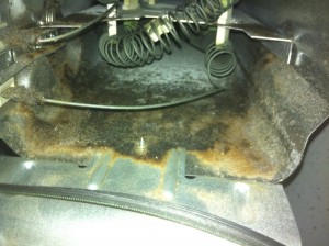 Burnt lint around the dryer heating element